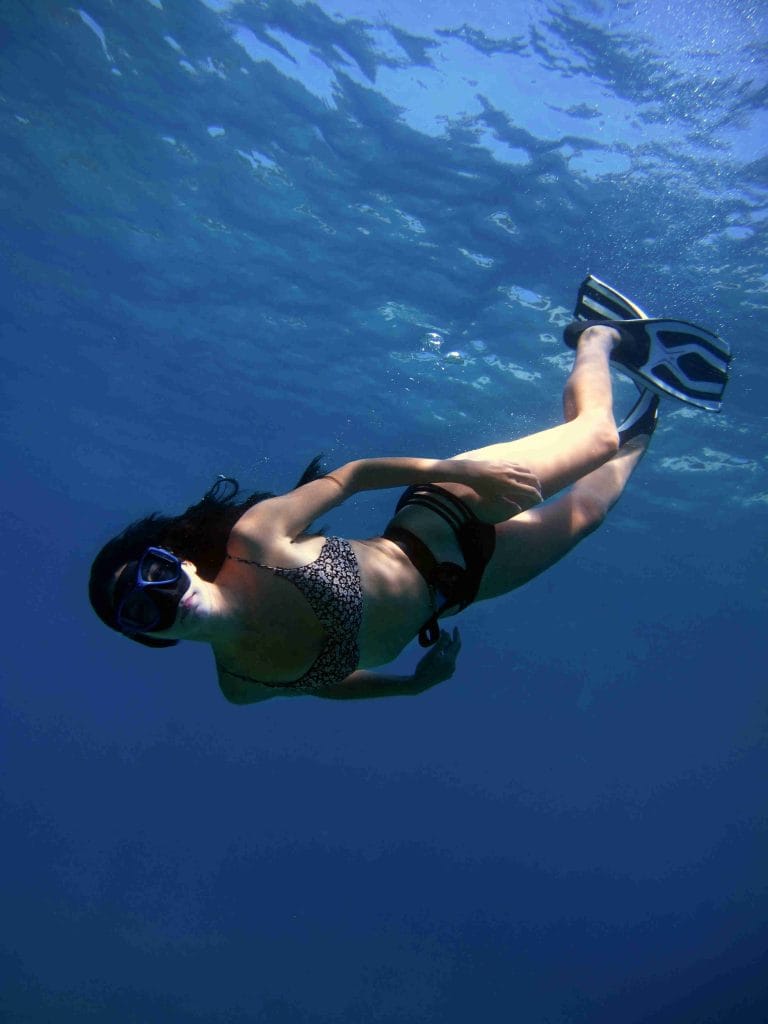 Girl snorkeling playa potrero under the waters of the Pacific Ocean in Costa RIca