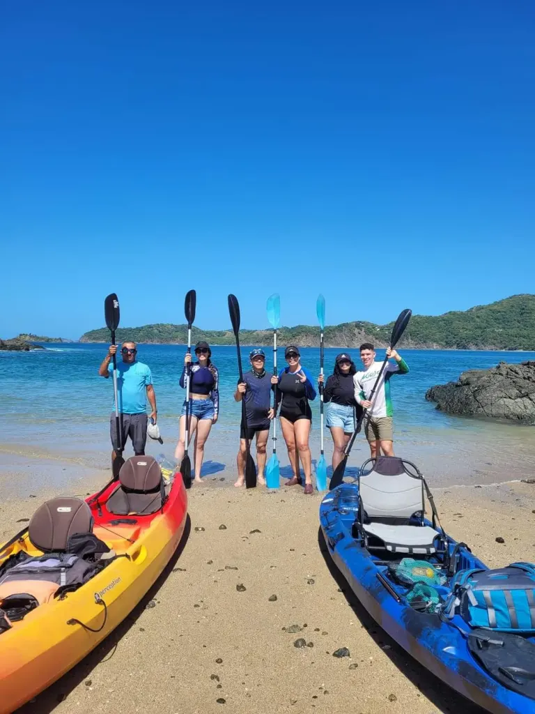 Group ready for a kayak snorkeling tour on the beach near Playa Potrero, Costa Rica