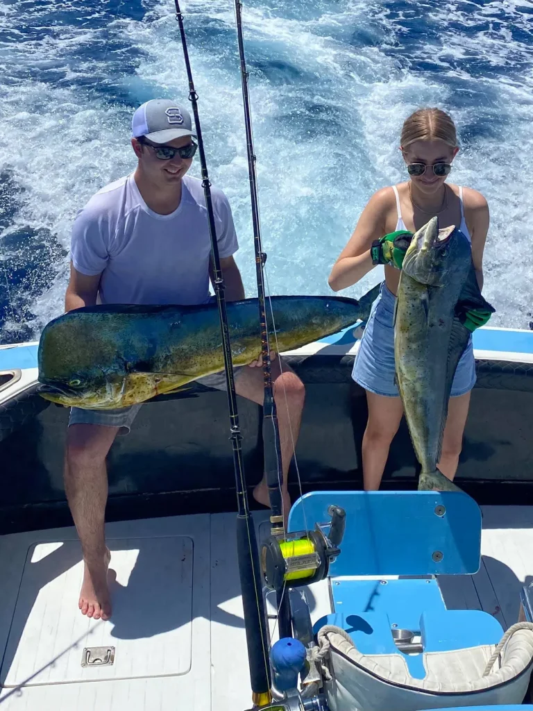 Two anglers with a pair of dorado (mahi-mahi) aboard the Wetass II off Costa Rica