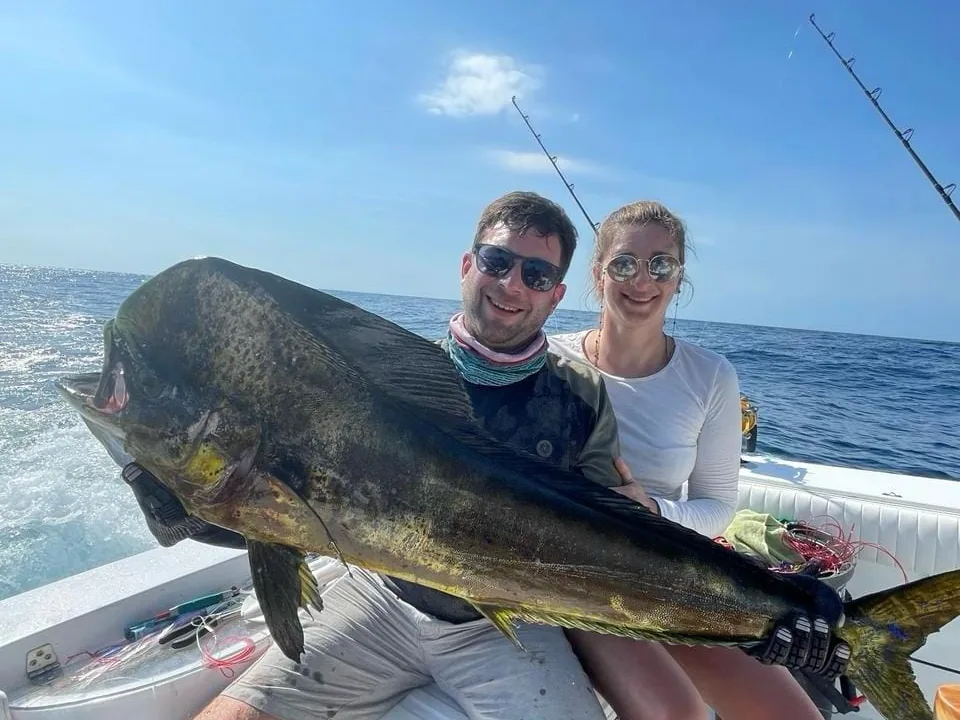 Anglers with a large dorado (mahi-mahi) aboard the Amberjack, Playa Flamingo, Costa Rica