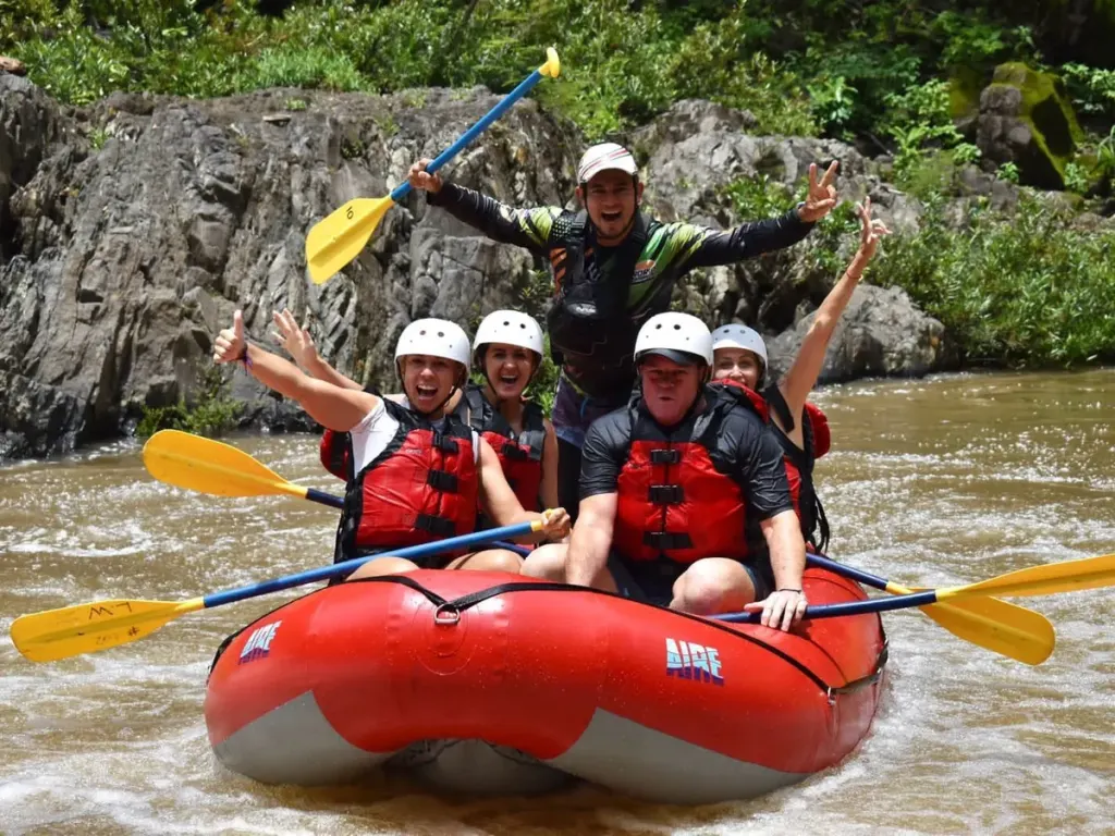 Excited rafters on a Tenorio River whitewater rafting adventure, Costa Rica