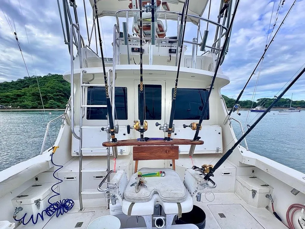 Fish Tale II cockpit with fighting chair and rigged offshore rods ready for a charter