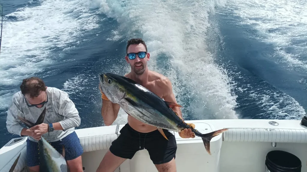 Angler with a yellowfin tuna aboard the Dream On sport fishing charter, Costa Rica