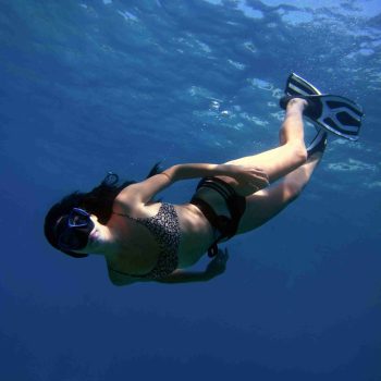 Girl snorkeling playa potrero under the waters of the Pacific Ocean in Costa RIca